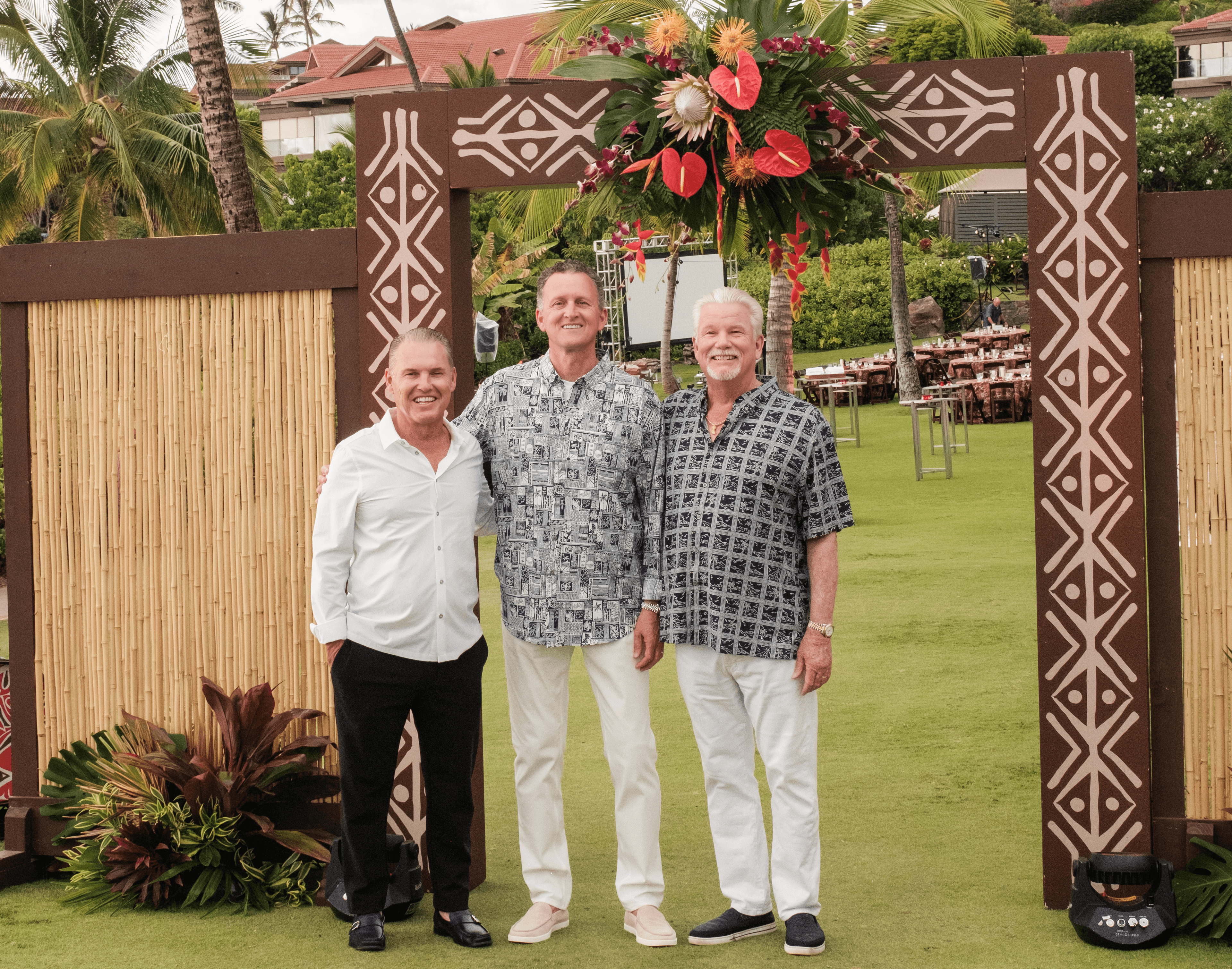 David Fischer and Scott Heising with members from Promises2Kids holding a contribution check.